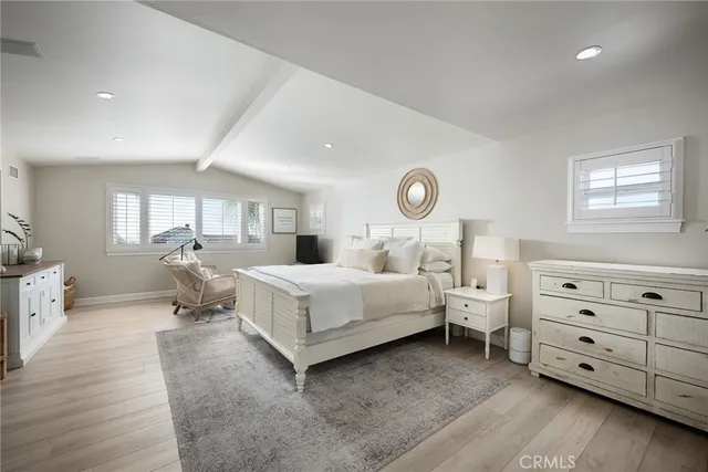 a room with bed and window