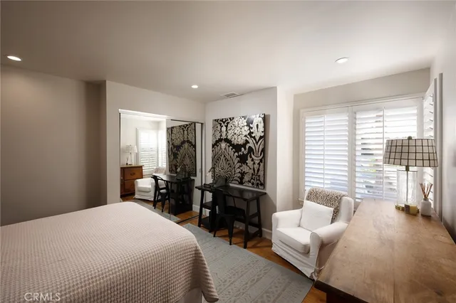 a bedroom with a bed and a couch