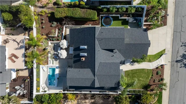 an aerial view of houses with outdoor space