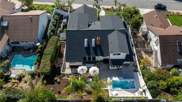 an aerial view of a house with a yard