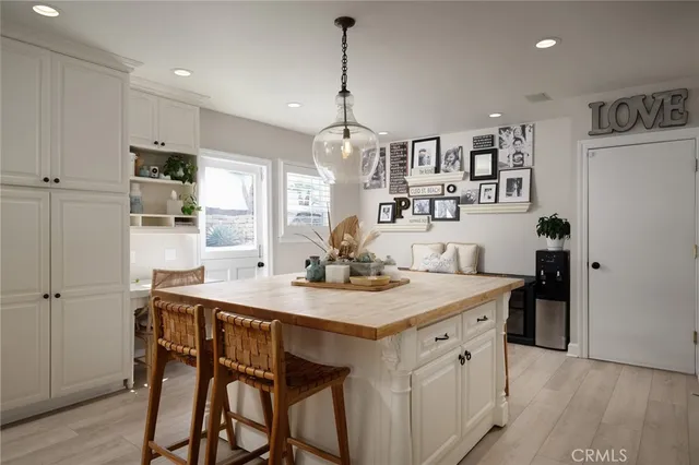 a kitchen that has a cabinets and a table in it