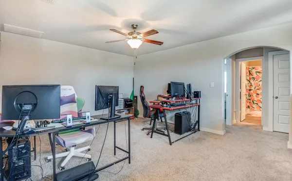 a view of a livingroom with furniture workspace and a window