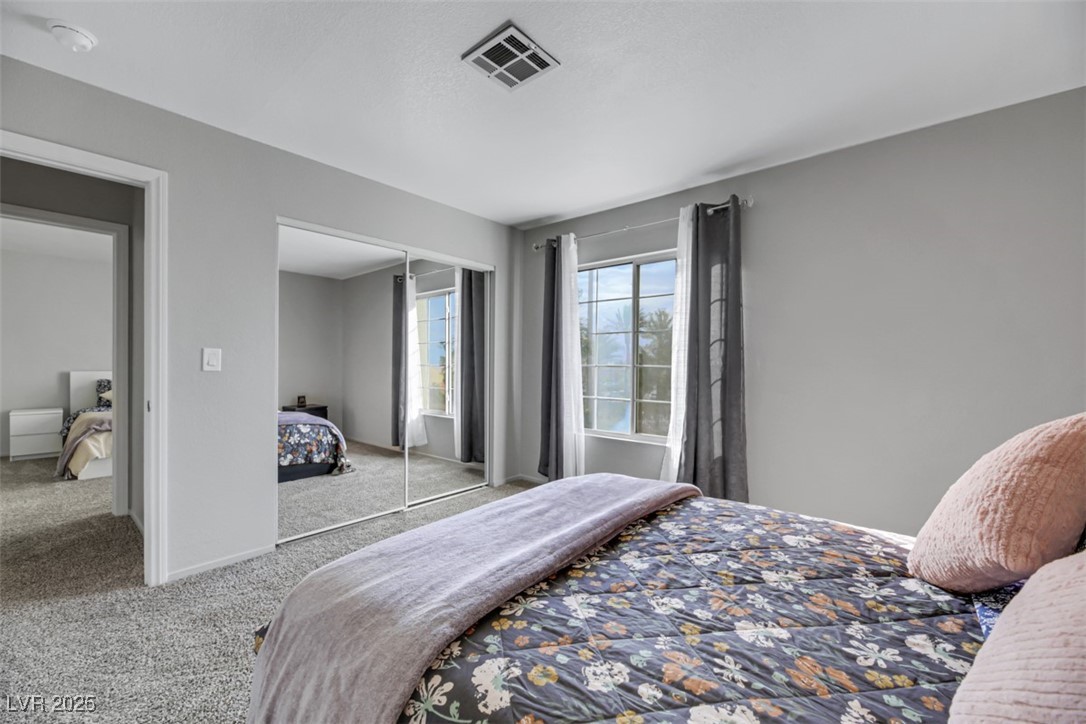 2907 Rio Sonora Court Henderson, NV 89074 - Photo 30 of 35 Bedroom featuring carpet and a closet