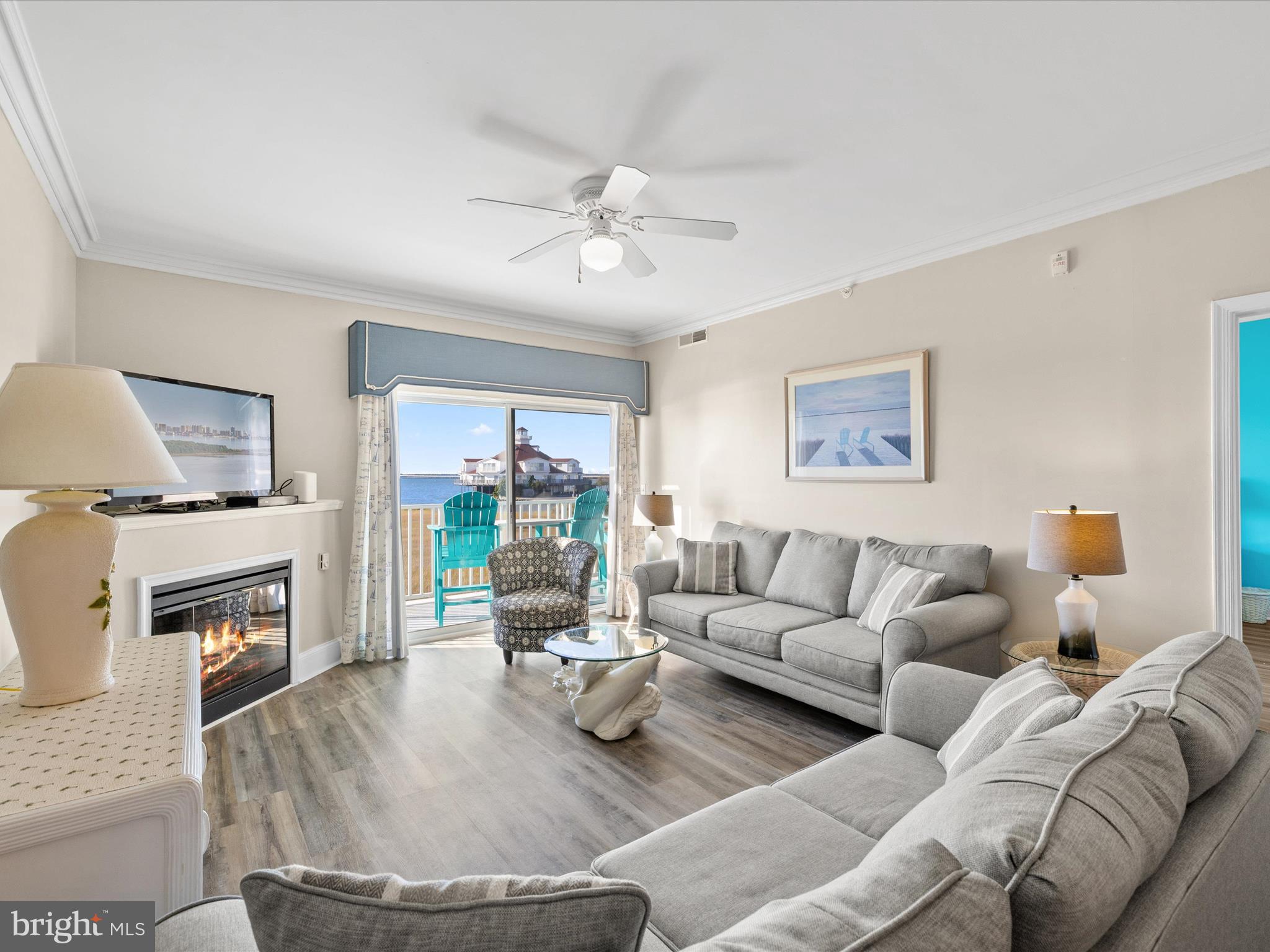 105 56th Street, Unit 205 P1 Ocean City, MD 21842 - Photo 11 of 40 a living room with furniture and a fireplace