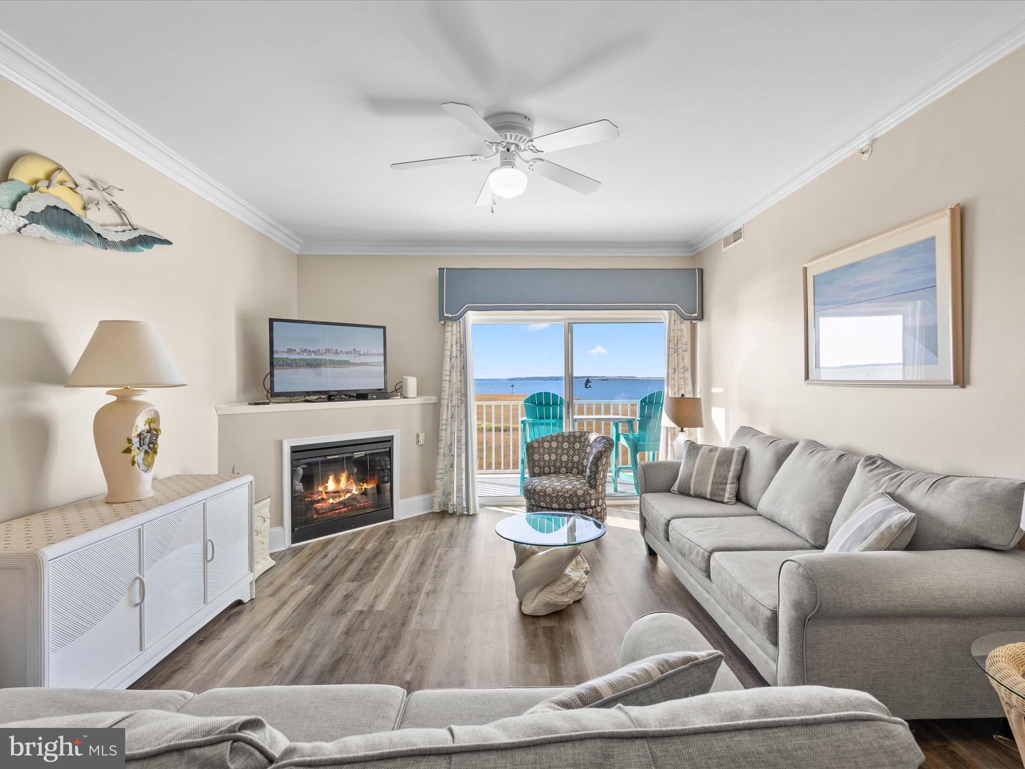 105 56th Street, Unit 205 P1 Ocean City, MD 21842 - Photo 12 of 40 a living room with furniture and a fireplace
