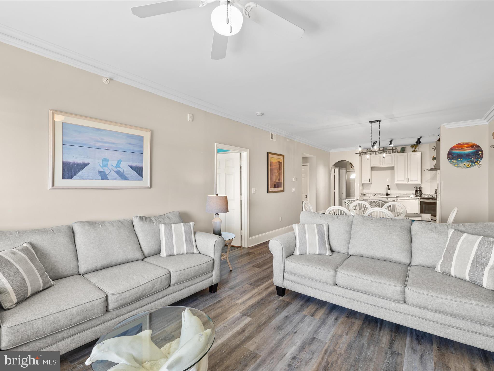 105 56th Street, Unit 205 P1 Ocean City, MD 21842 - Photo 13 of 40 a living room with furniture and a wooden floor