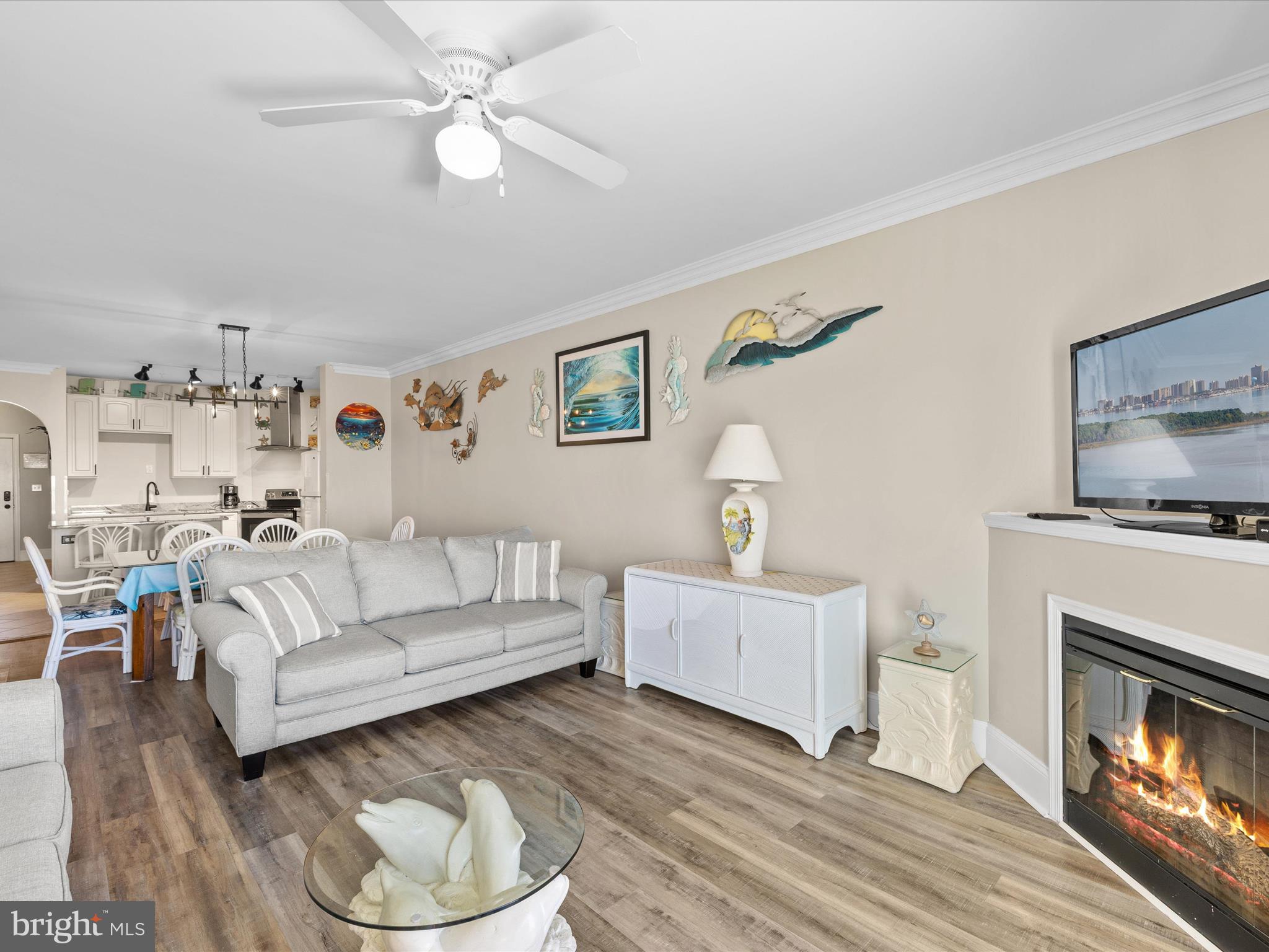 105 56th Street, Unit 205 P1 Ocean City, MD 21842 - Photo 14 of 40 a living room with furniture and a fireplace