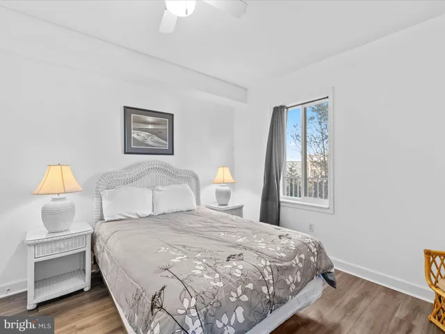 a bedroom with a bed and a lamp on table