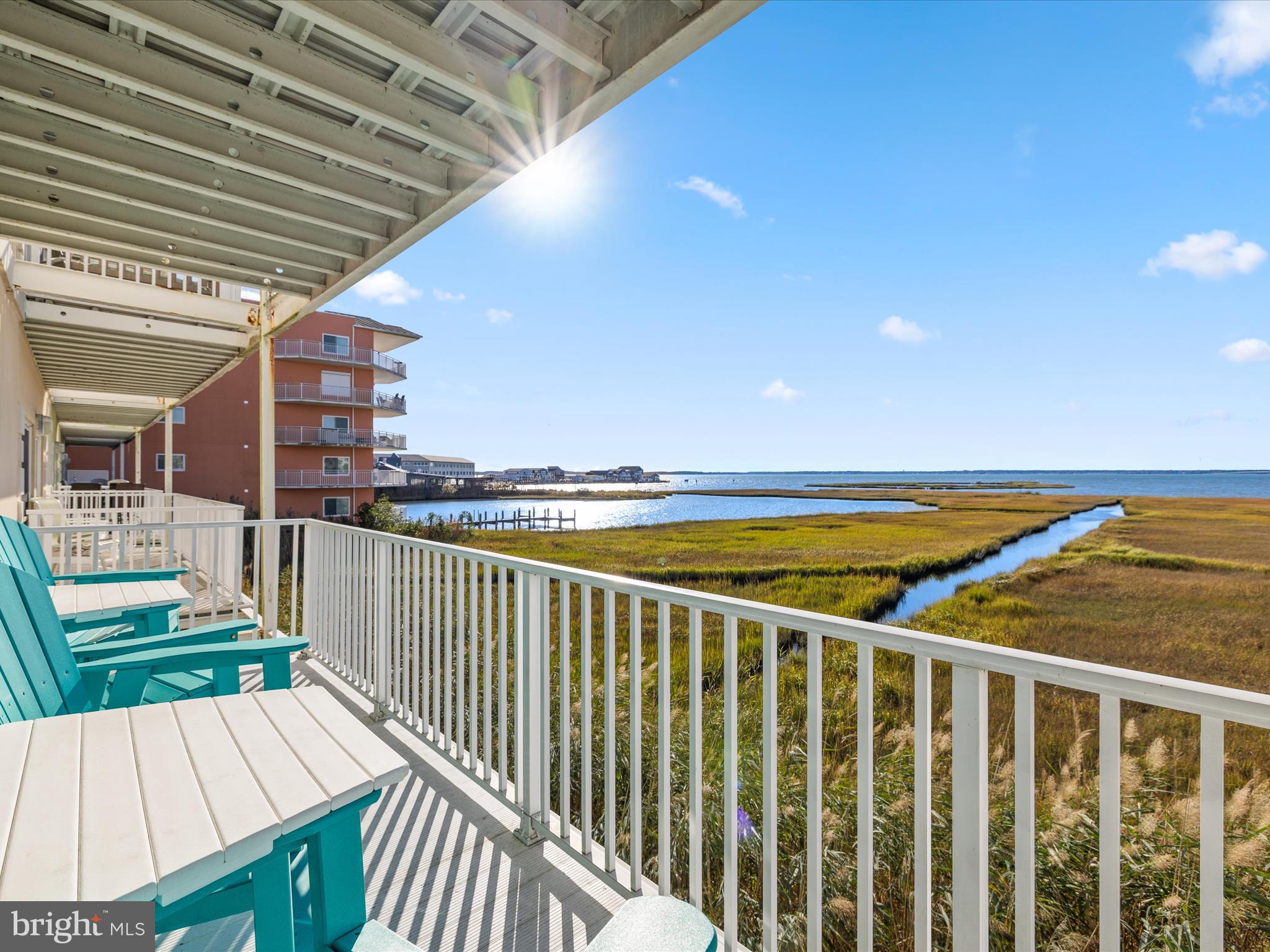 105 56th Street, Unit 205 P1 Ocean City, MD 21842 - Photo 28 of 40 a view of a balcony with wooden floor and outdoor space