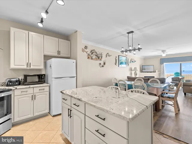 a kitchen with cabinets and stainless steel appliances