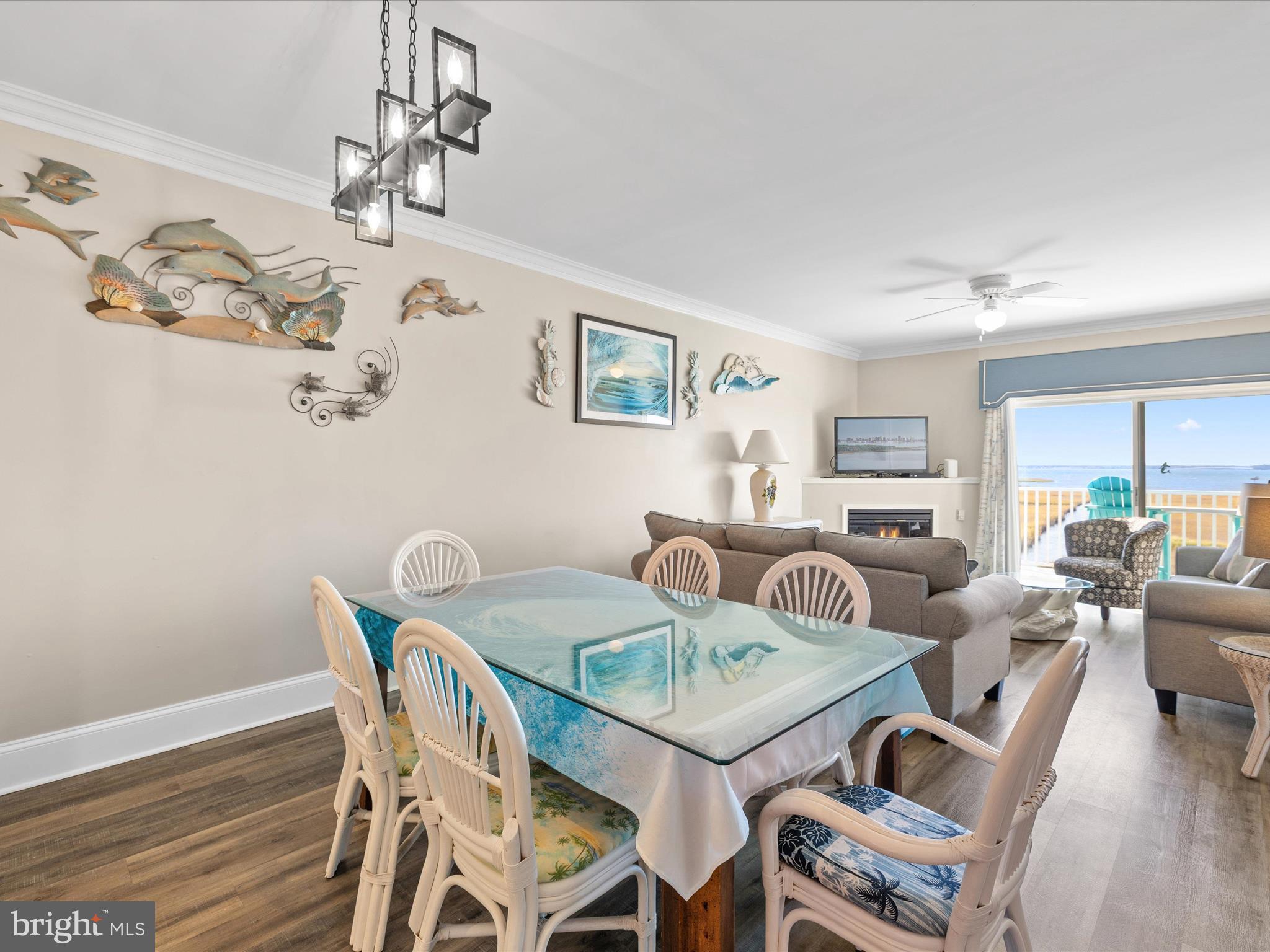 105 56th Street, Unit 205 P1 Ocean City, MD 21842 - Photo 6 of 40 a view of a dining room with furniture window and wooden floor