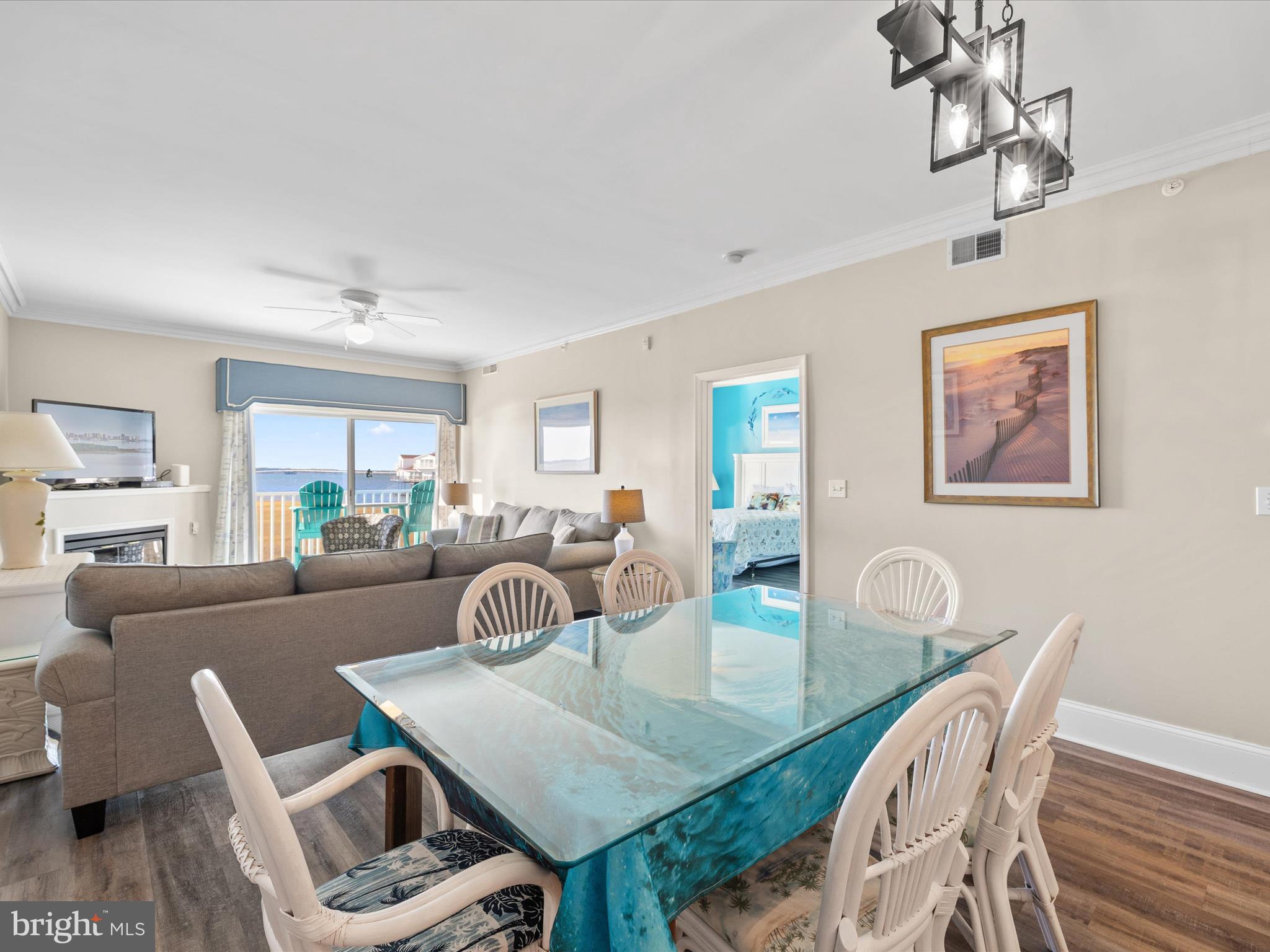 105 56th Street, Unit 205 P1 Ocean City, MD 21842 - Photo 7 of 40 a view of a dining room with furniture and wooden floor