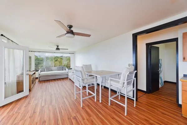 a view of a livingroom with furniture and wooden floor