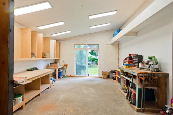 a bed room with a bed and a book shelf