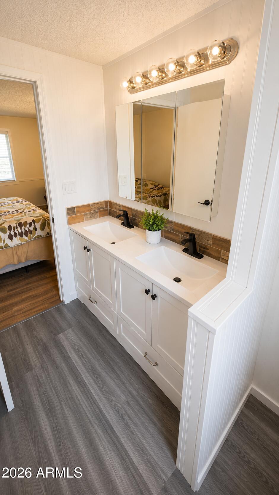 3330 East Main Street, Unit 332 Mesa, AZ 85213 - Photo 5 of 12 a bathroom with a sink and a mirror