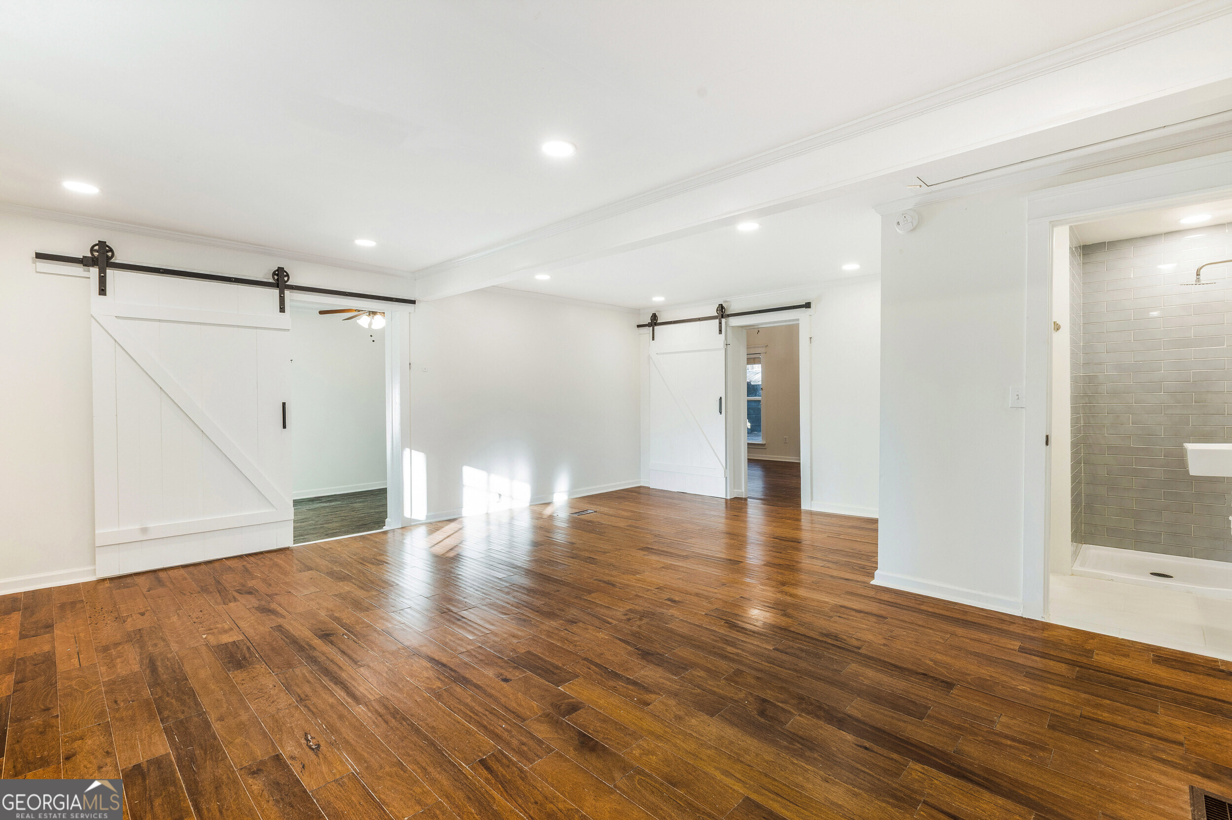 103 Campground School Road Dallas, GA 30157 - Photo 12 of 25 a view of an empty room with wooden floor and a window