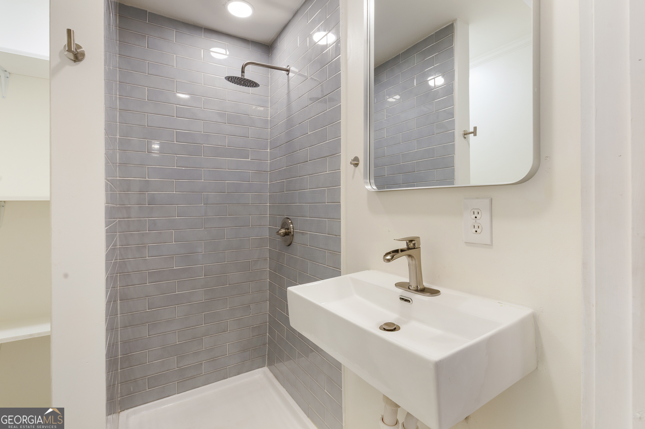 103 Campground School Road Dallas, GA 30157 - Photo 13 of 25 a bathroom with a sink a mirror and shower