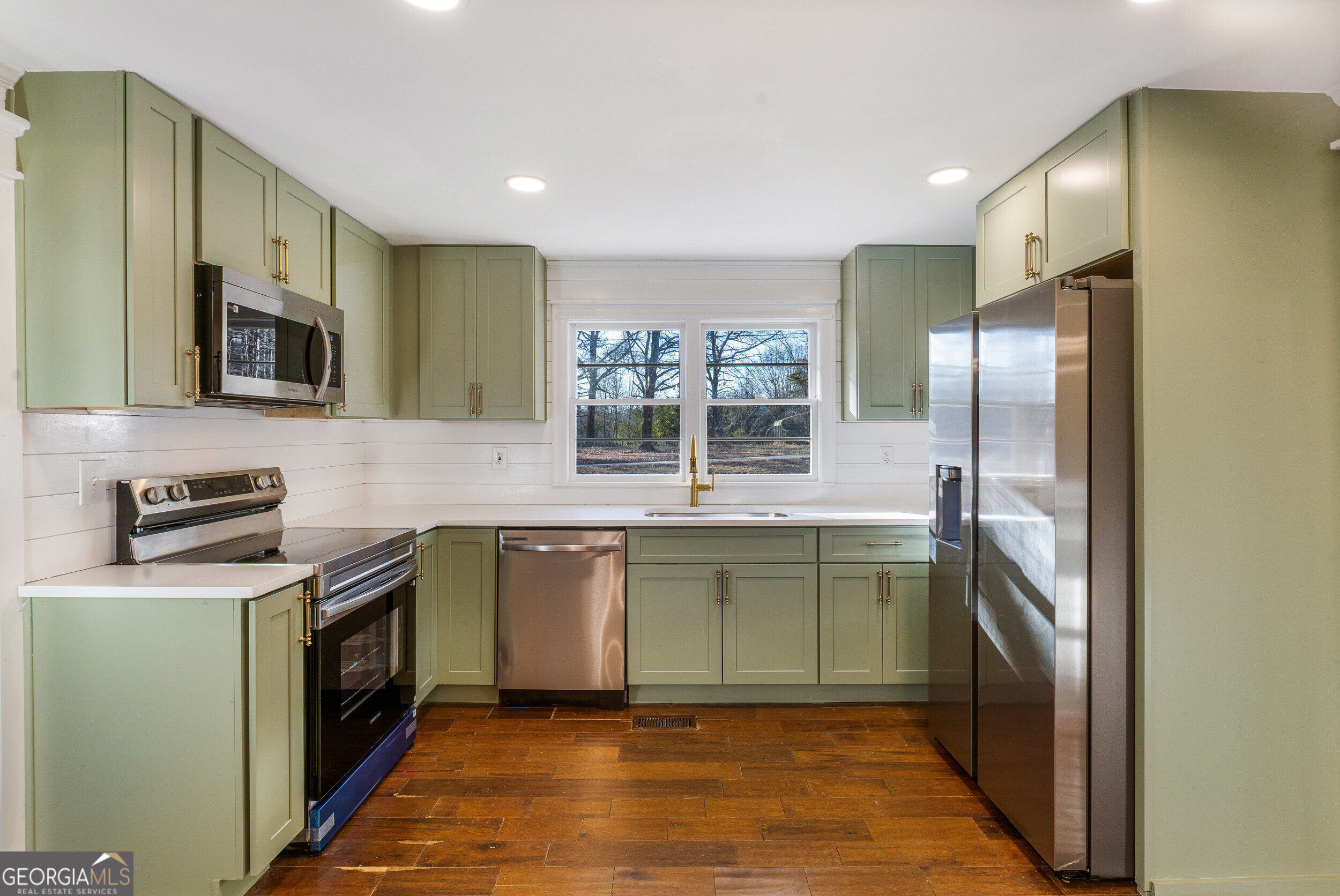 103 Campground School Road Dallas, GA 30157 - Photo 16 of 25 a kitchen with a sink cabinets and stainless steel appliances