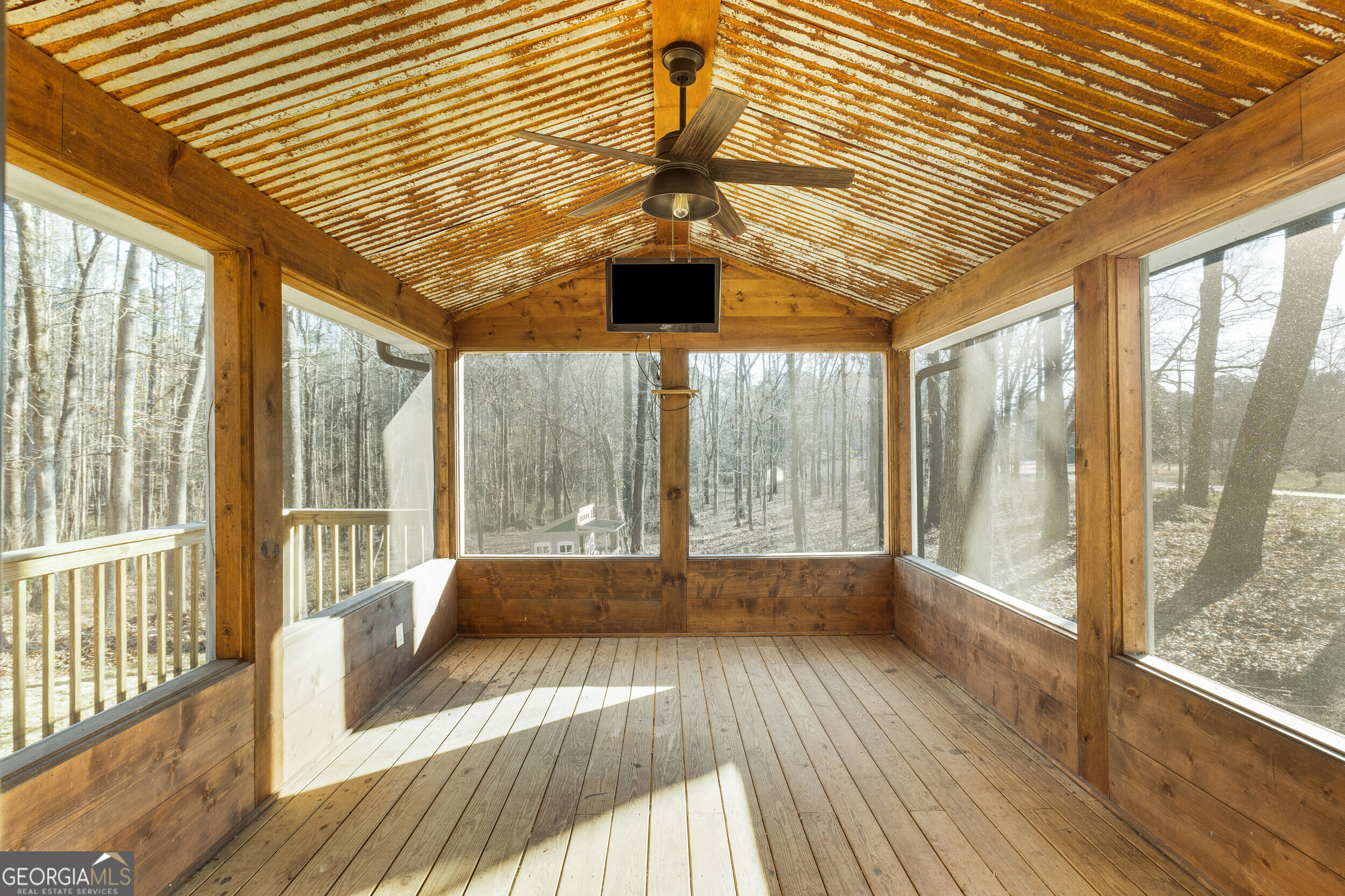 103 Campground School Road Dallas, GA 30157 - Photo 22 of 25 a view of an empty room with wooden floor and a window