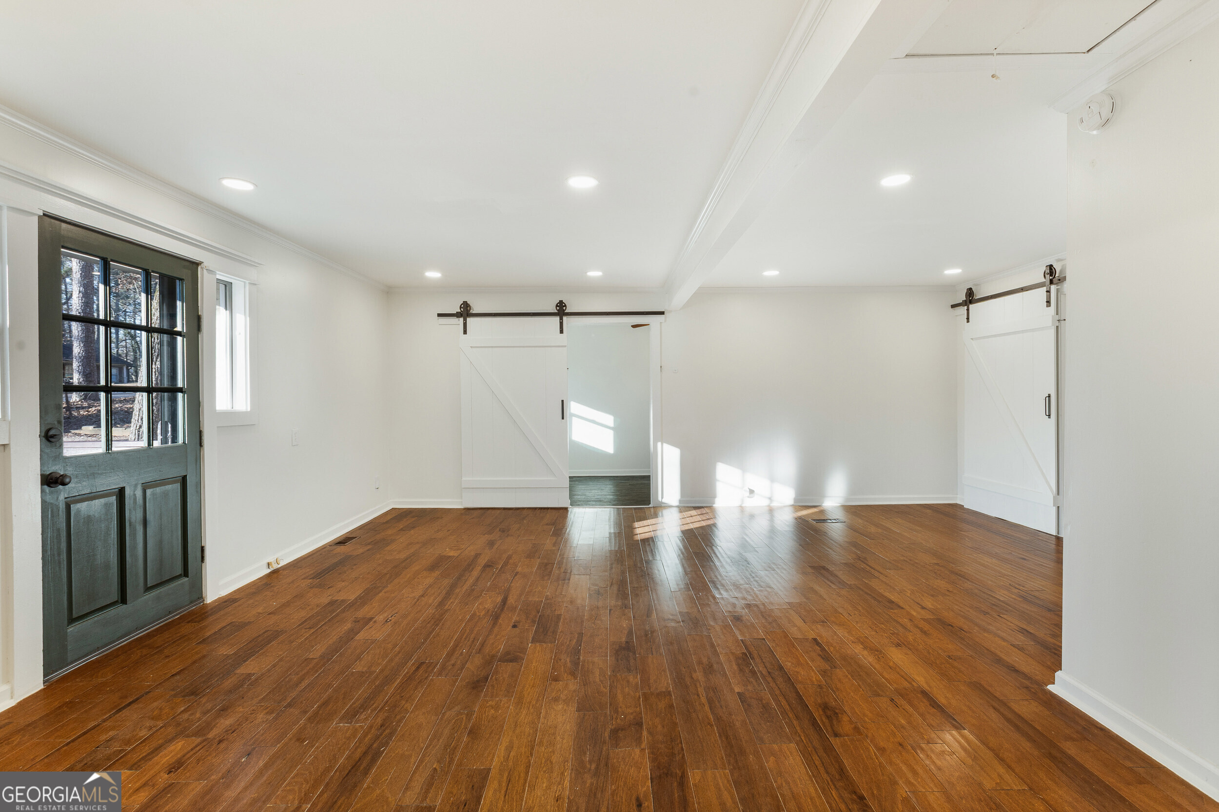 103 Campground School Road Dallas, GA 30157 - Photo 4 of 25 a view of empty room with wooden floor and fan
