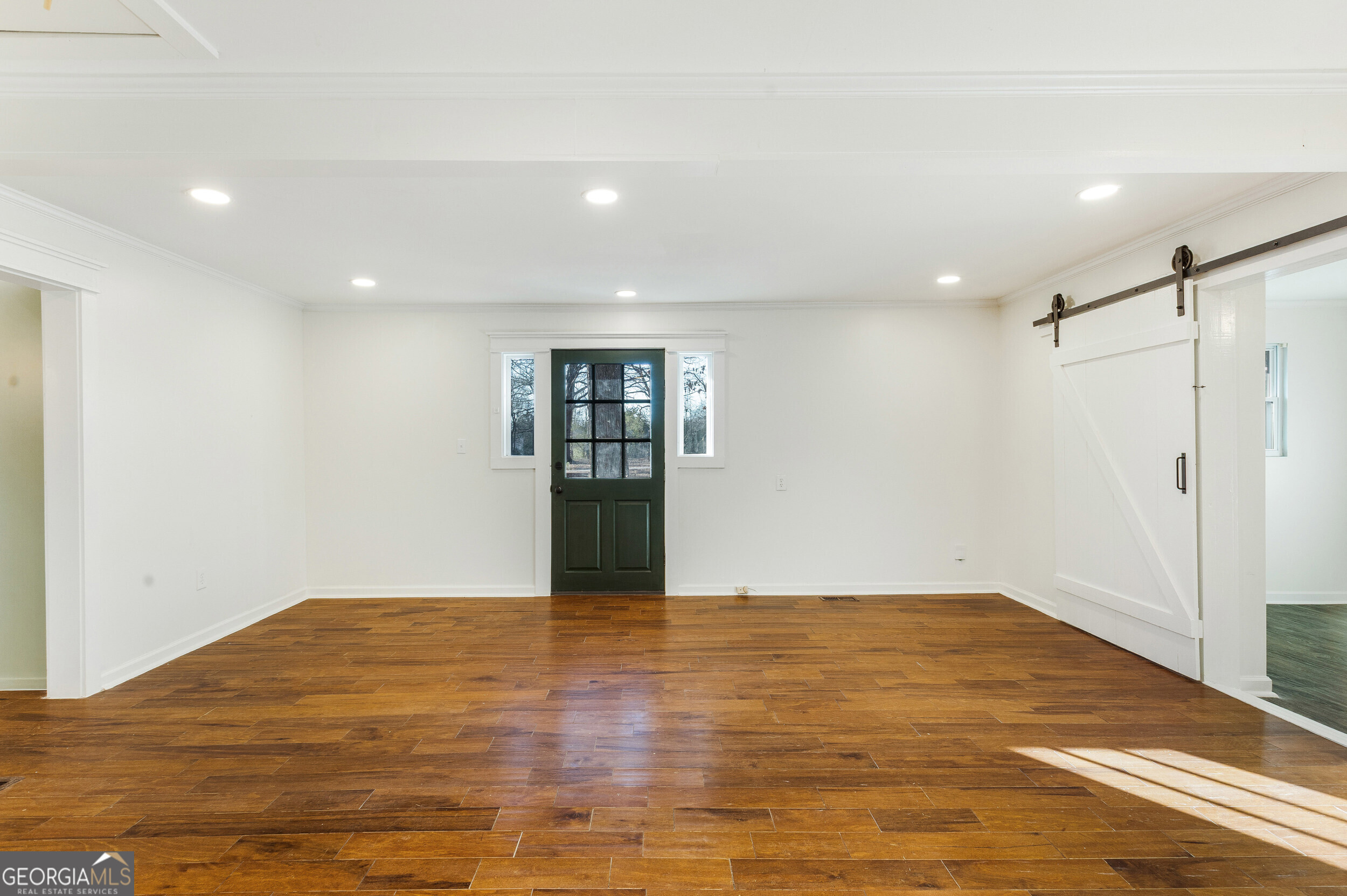 103 Campground School Road Dallas, GA 30157 - Photo 5 of 25 a view of an empty room with wooden floor and a window