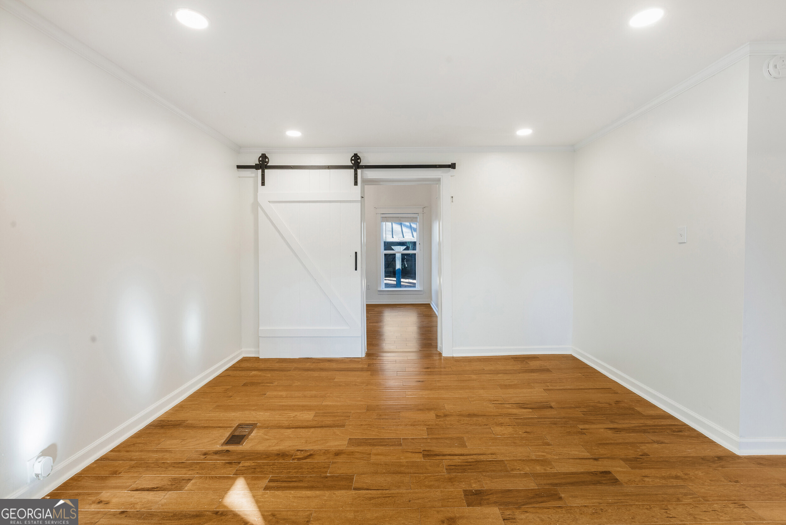 103 Campground School Road Dallas, GA 30157 - Photo 6 of 25 a view of empty room with wooden floor and fan