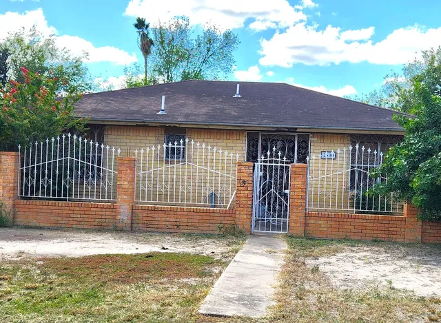 a house view with a garden space