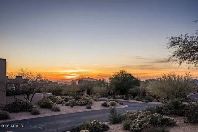 a view of a roof deck with couches and wooden floor