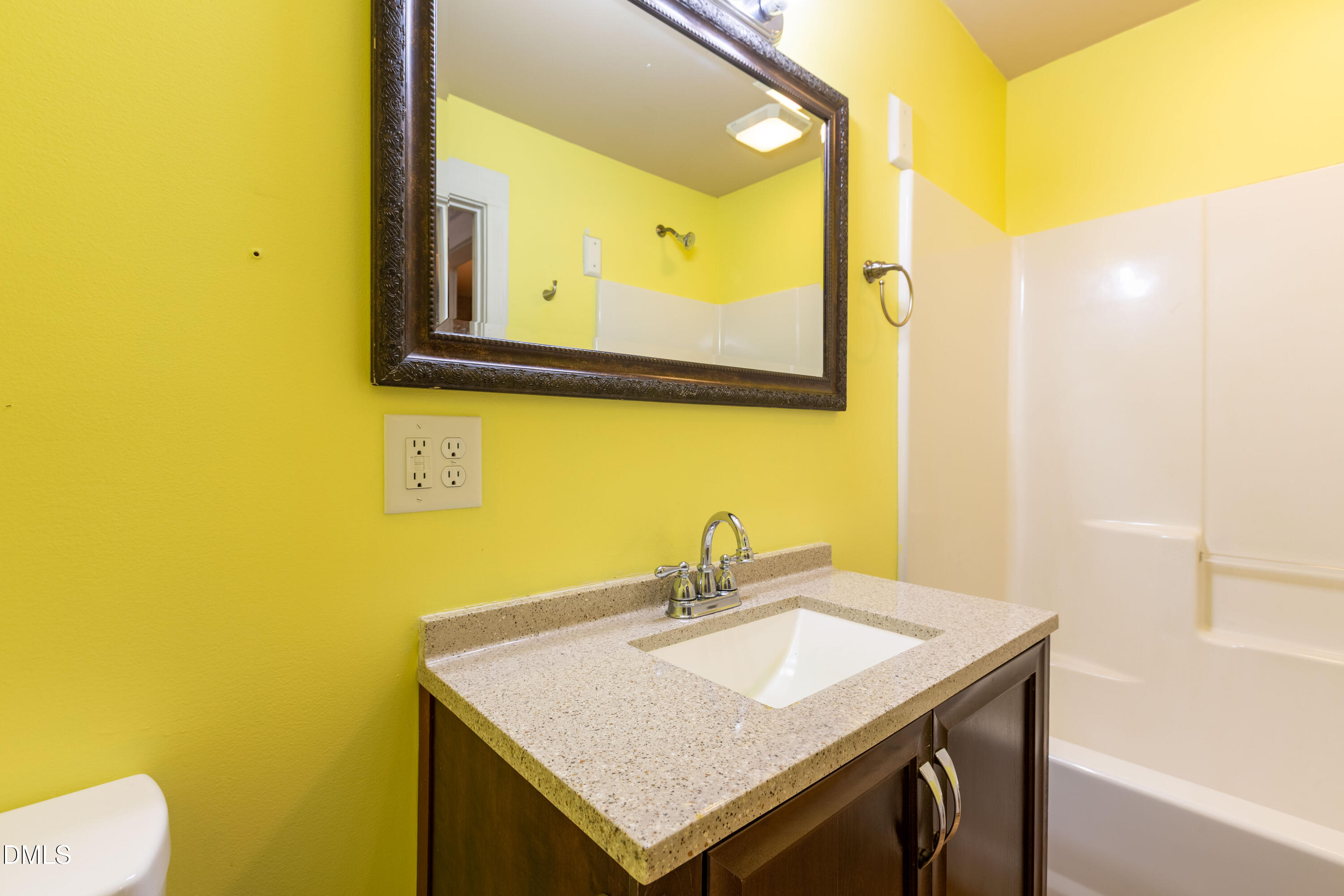 4295 Virgilina Road Roxboro, NC 27574 - Photo 25 of 46 a bathroom with a sink and a mirror