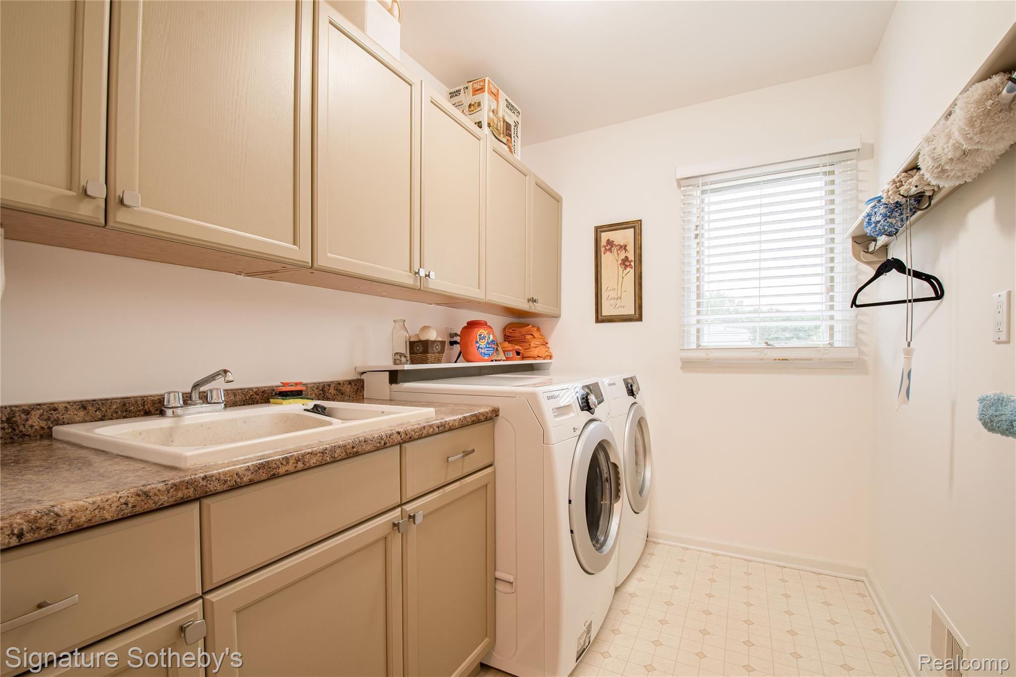745 West Ridge Court Lake Orion, MI 48359 - Photo 20 of 44 First floor laundry adjacent to garage
