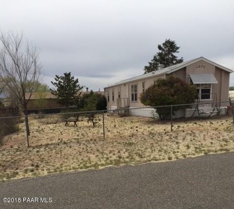 1275 Prairiegrass Road Chino Valley, AZ 86323 - Photo 1 of 1 a house view with a garden