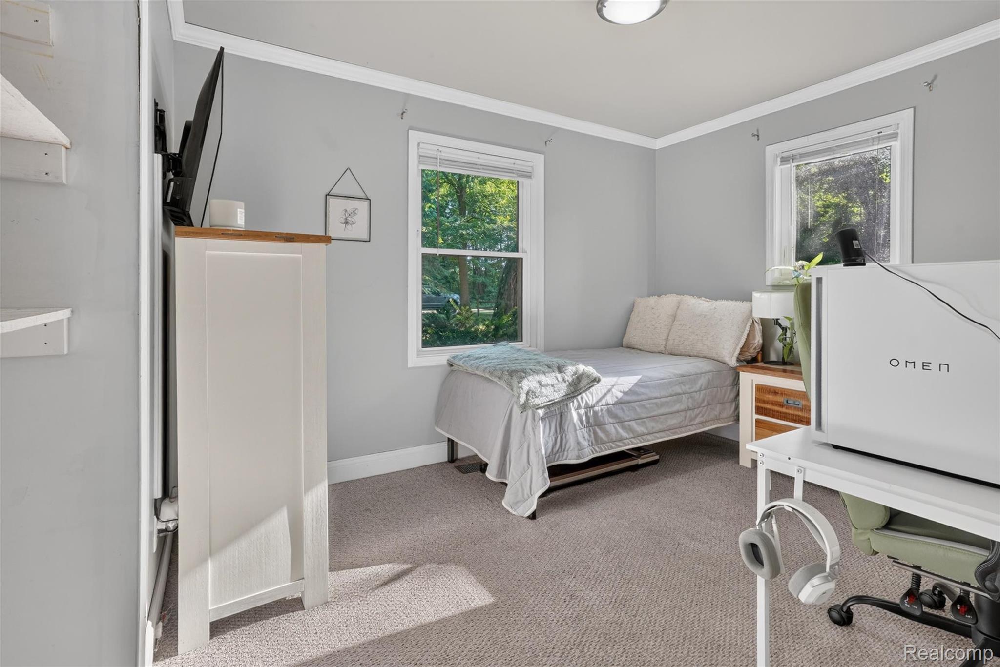 8696 West Sargent Road Fowlerville, MI 48836 - Photo 19 of 36 Room featuring light gray walls, white trim, and two double-hung windows