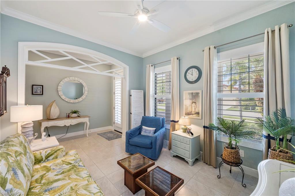 1287 Manado Drive Naples, FL 34113 - Photo 11 of 32 a living room with furniture and a large window