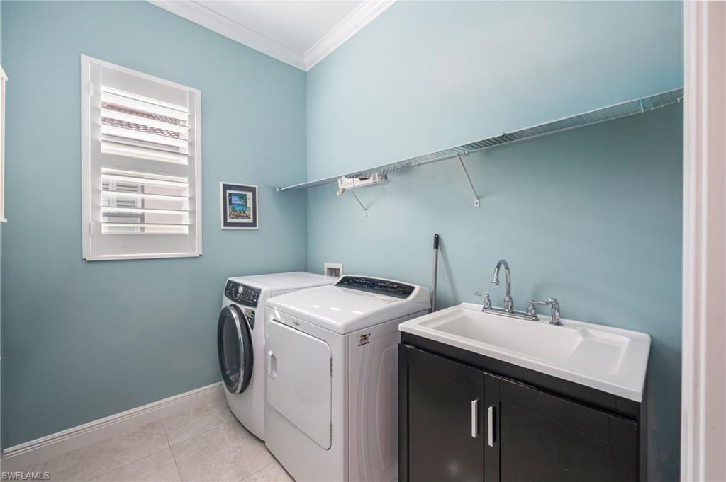 1287 Manado Drive Naples, FL 34113 - Photo 18 of 32 a utility room with dryer and washer