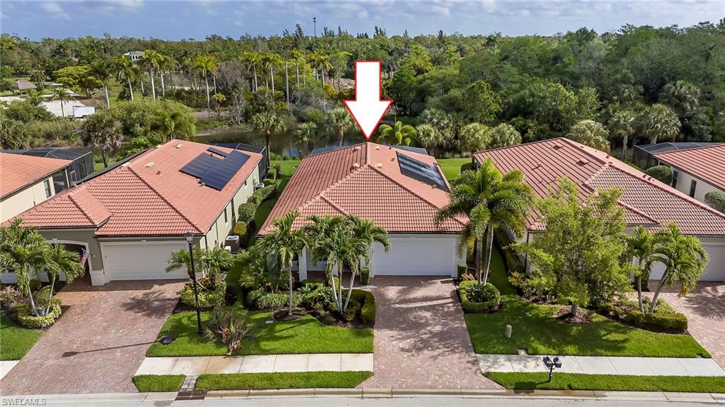 1287 Manado Drive Naples, FL 34113 - Photo 2 of 32 a aerial view of a house with garden