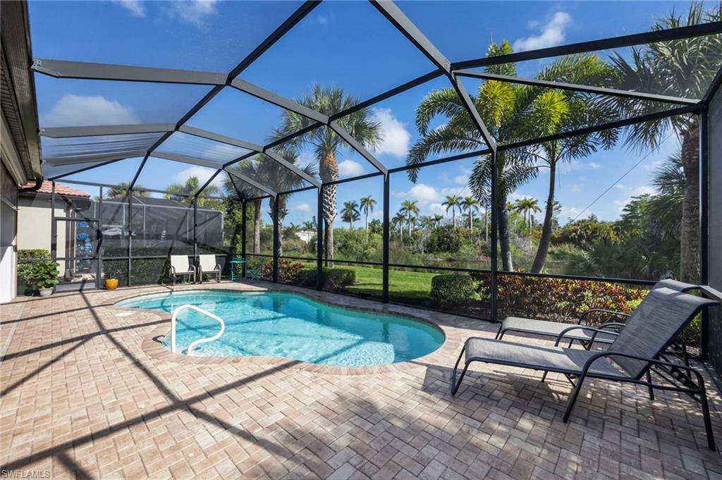 1287 Manado Drive Naples, FL 34113 - Photo 22 of 32 a view of a backyard with sitting area