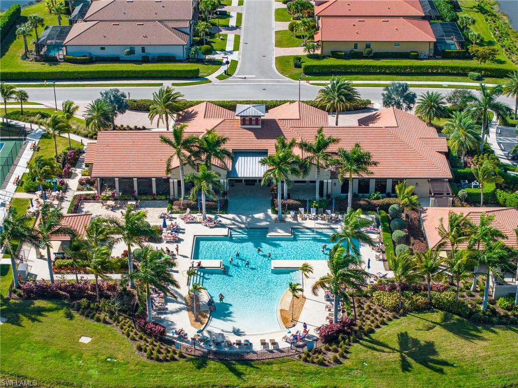 1287 Manado Drive Naples, FL 34113 - Photo 27 of 32 a view of swimming pool and outdoor seating