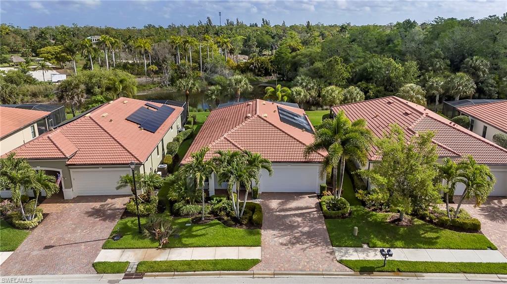 1287 Manado Drive Naples, FL 34113 - Photo 3 of 32 a aerial view of a house with garden