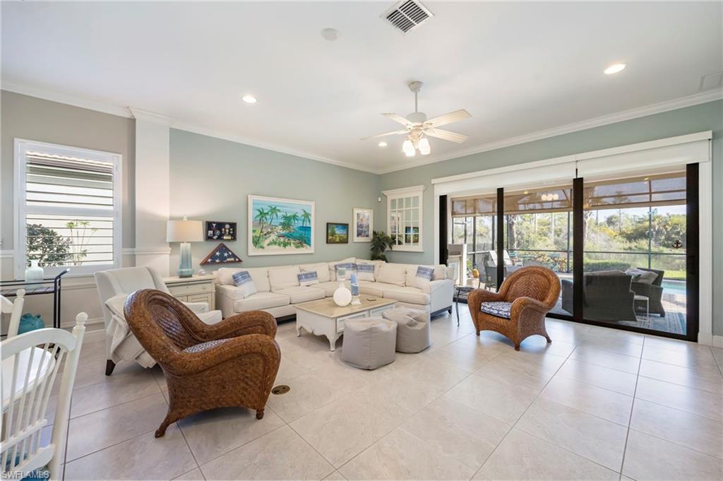1287 Manado Drive Naples, FL 34113 - Photo 5 of 32 a living room with furniture and a large window