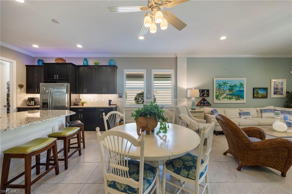 1287 Manado Drive Naples, FL 34113 - Photo 6 of 32 a view of a dining room with furniture