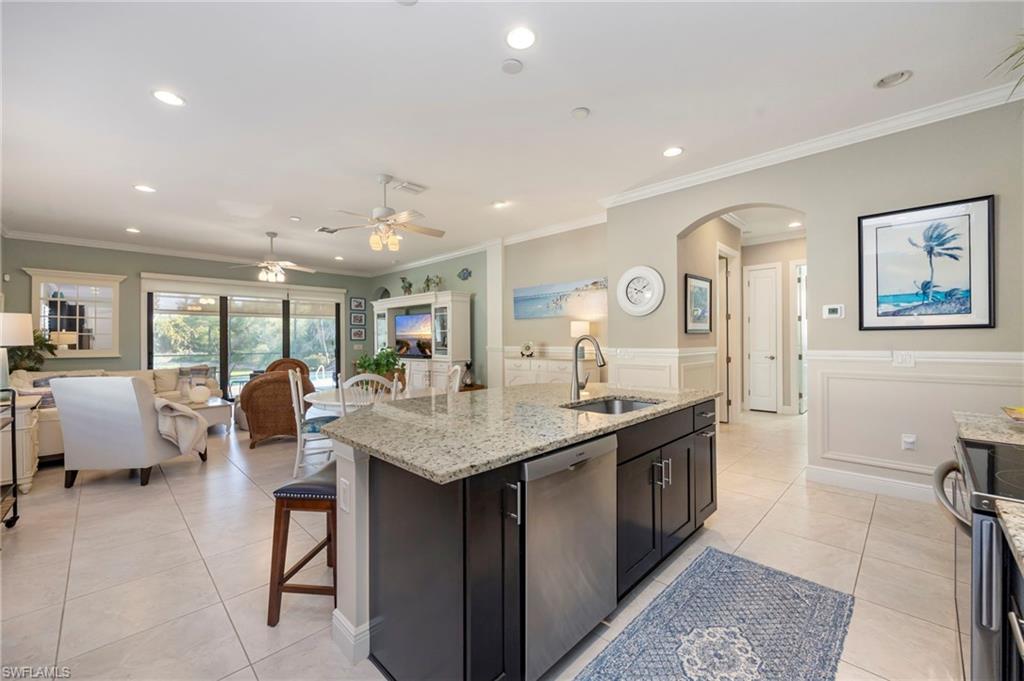 1287 Manado Drive Naples, FL 34113 - Photo 8 of 32 a large kitchen with lots of counter space and a sink