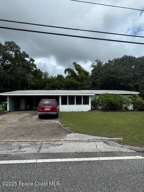 2840 West Jay Jay Road Titusville, FL 32796 - Photo 2 of 8 a view of a house with a big yard