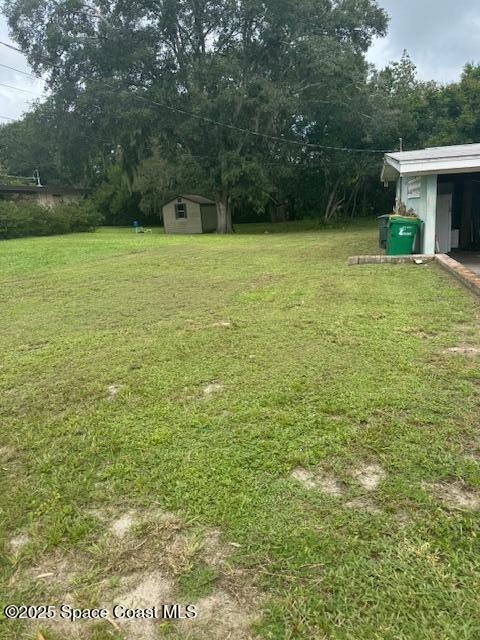 2840 West Jay Jay Road Titusville, FL 32796 - Photo 5 of 8 a view of a yard with a house