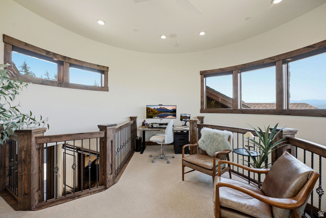 7885 North Rabbitbrush Court, Unit 13 Park City, UT 84098 - Photo 60 of 88 Curved loft space featuring recessed lighting, carpet flooring, and a wood and wrought iron railing system
