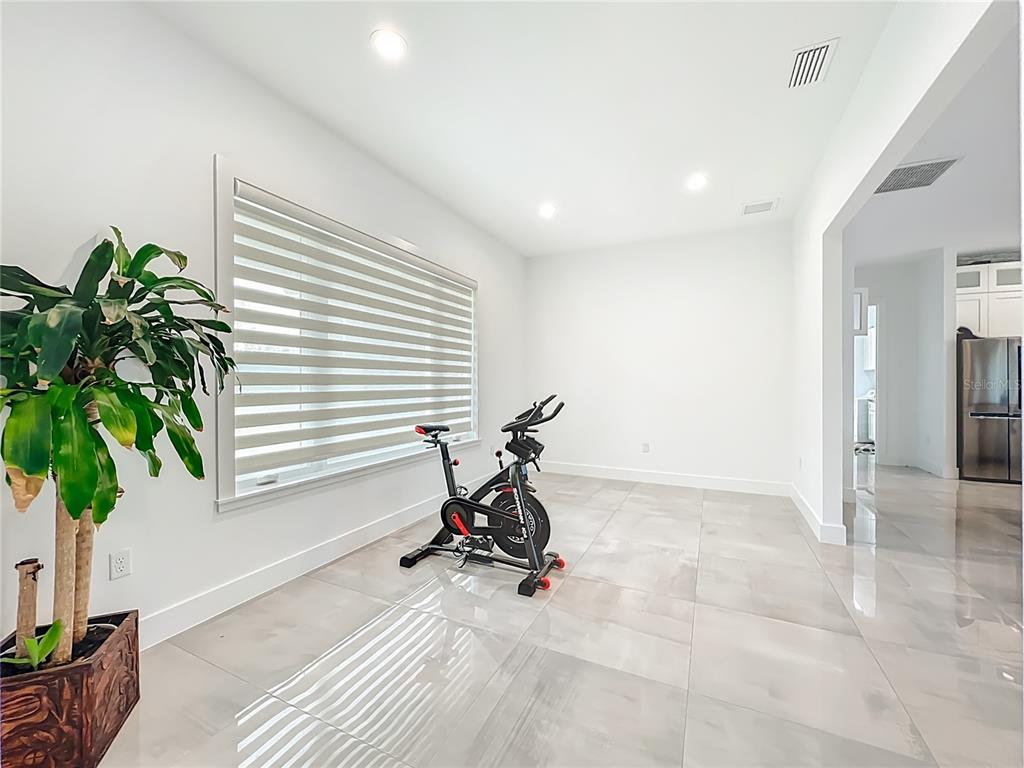 540 Northwest 165th Ct Road Dunnellon, FL 34432 - Photo 14 of 85 a view of a room with gym equipment