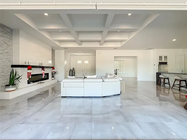 a kitchen with granite countertop a sink stainless steel appliances and cabinets