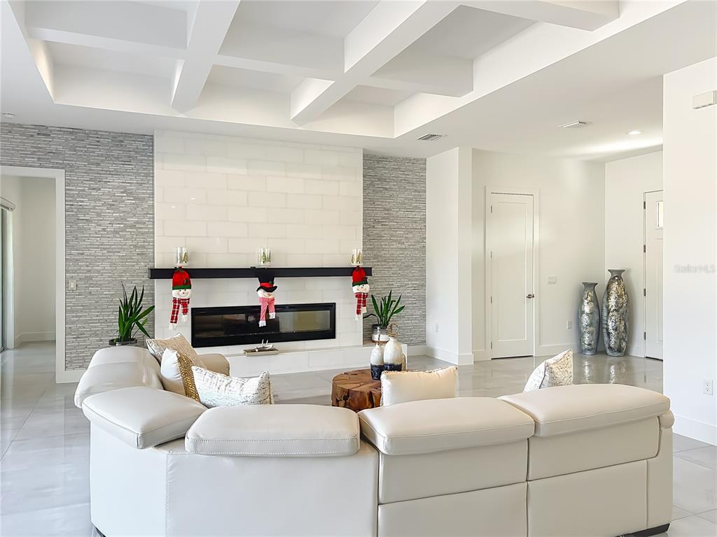 540 Northwest 165th Ct Road Dunnellon, FL 34432 - Photo 23 of 85 a living room with fireplace furniture and a flat screen tv