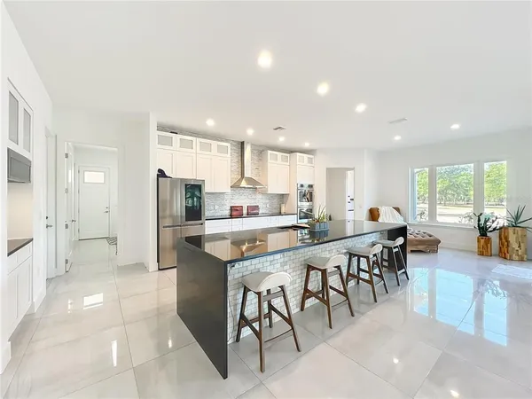a living room with granite countertop furniture and a mirror
