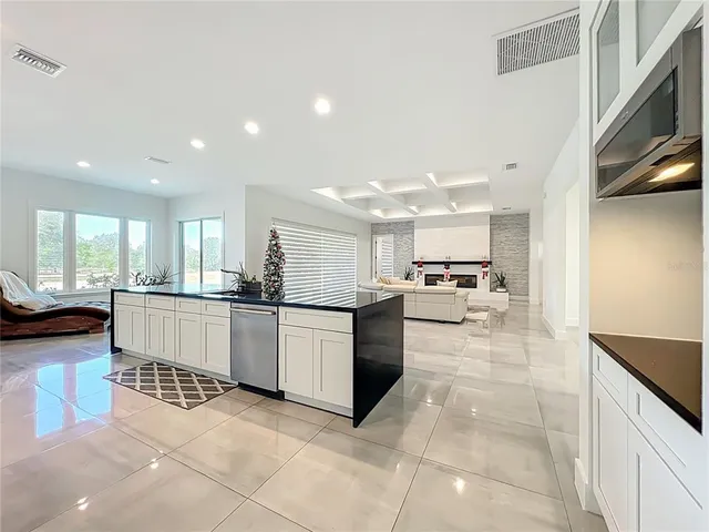 a living room with granite countertop furniture and a mirror