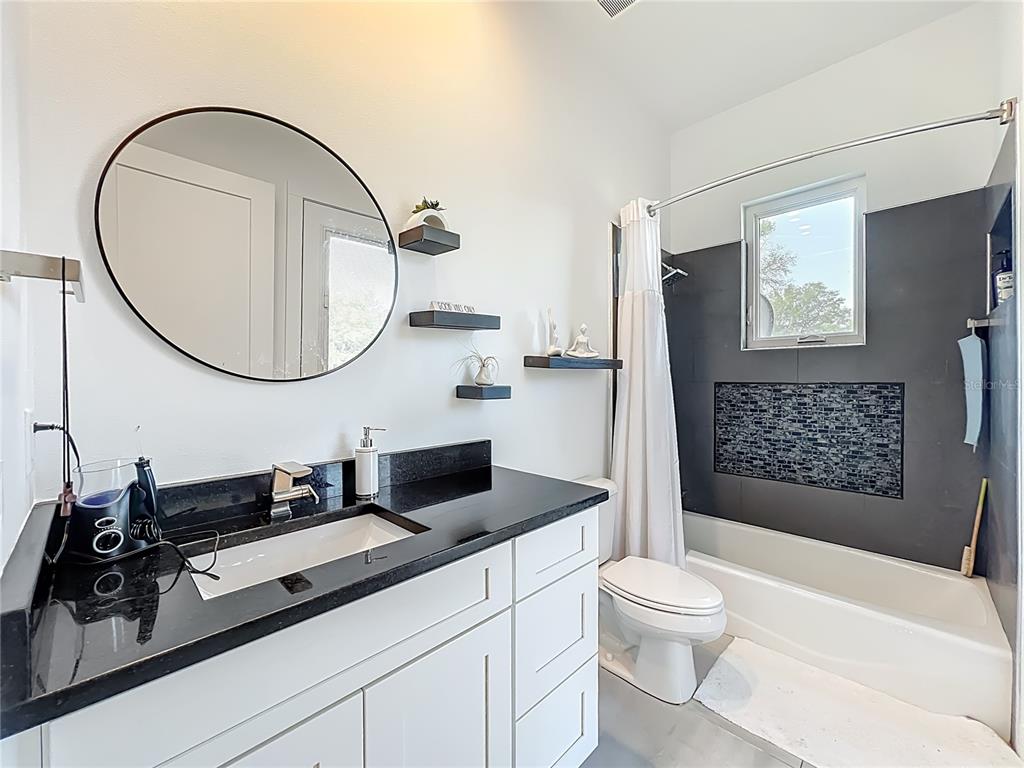540 Northwest 165th Ct Road Dunnellon, FL 34432 - Photo 35 of 85 a bathroom with a toilet a sink and mirror